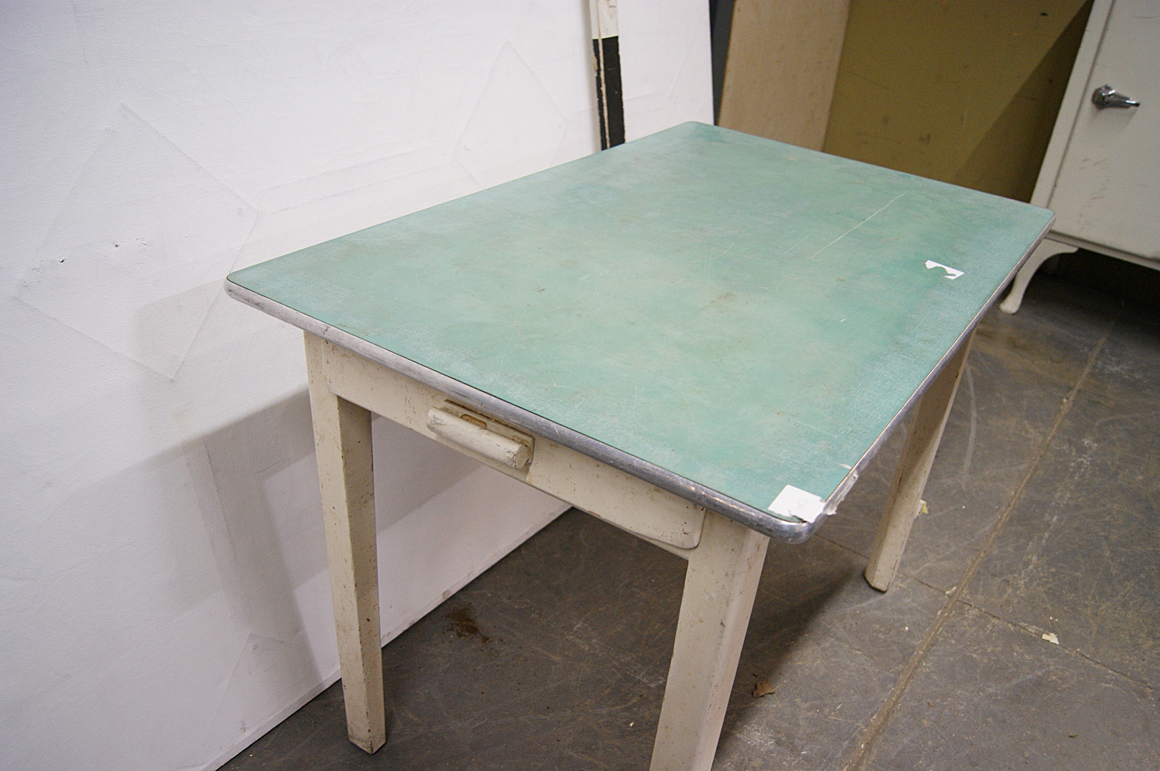 1180136 Green Formica Top Kitchen Table With Drawer H 77cm X 107 X 69 Stockyard Prop And Backdrop Hire